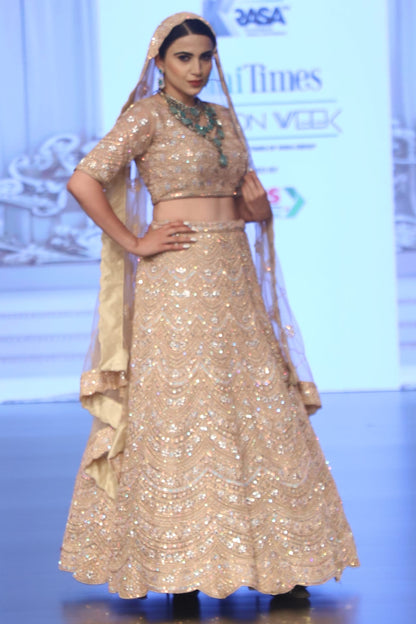 Pastel peach Bridal lehenga with Delicate Work