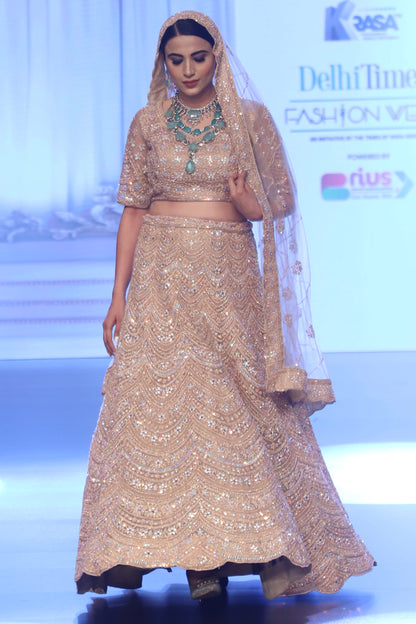 Pastel peach Bridal lehenga with Delicate Work