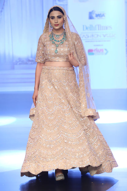 Pastel peach Bridal lehenga with Delicate Work
