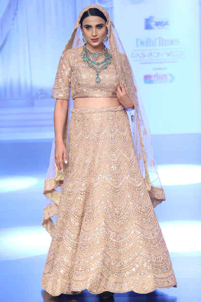 Pastel peach Bridal lehenga with Delicate Work