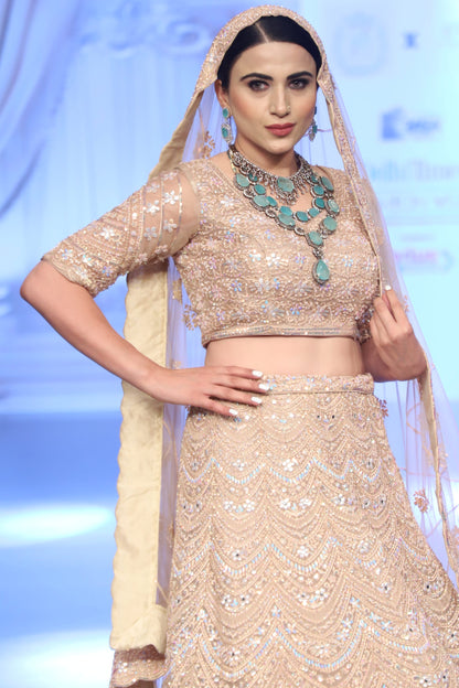Pastel peach Bridal lehenga with Delicate Work